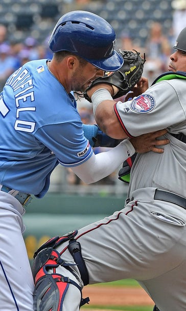 Royals rally with big eighth-inning, but fall 5-3 in extras